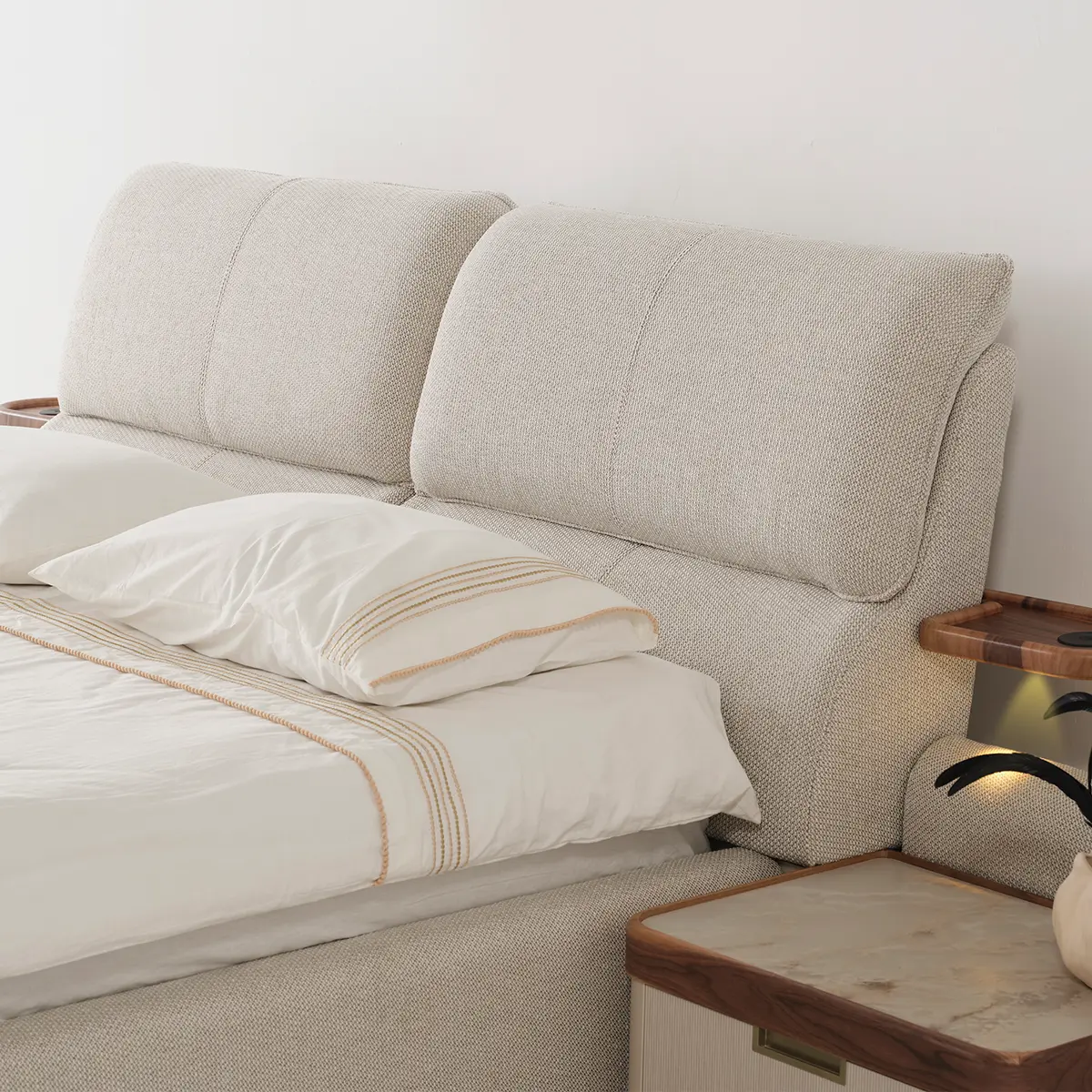 Close-up of Estella bed headboard in Cream boucle with Marble-effect nightstand – Asbar Furniture
