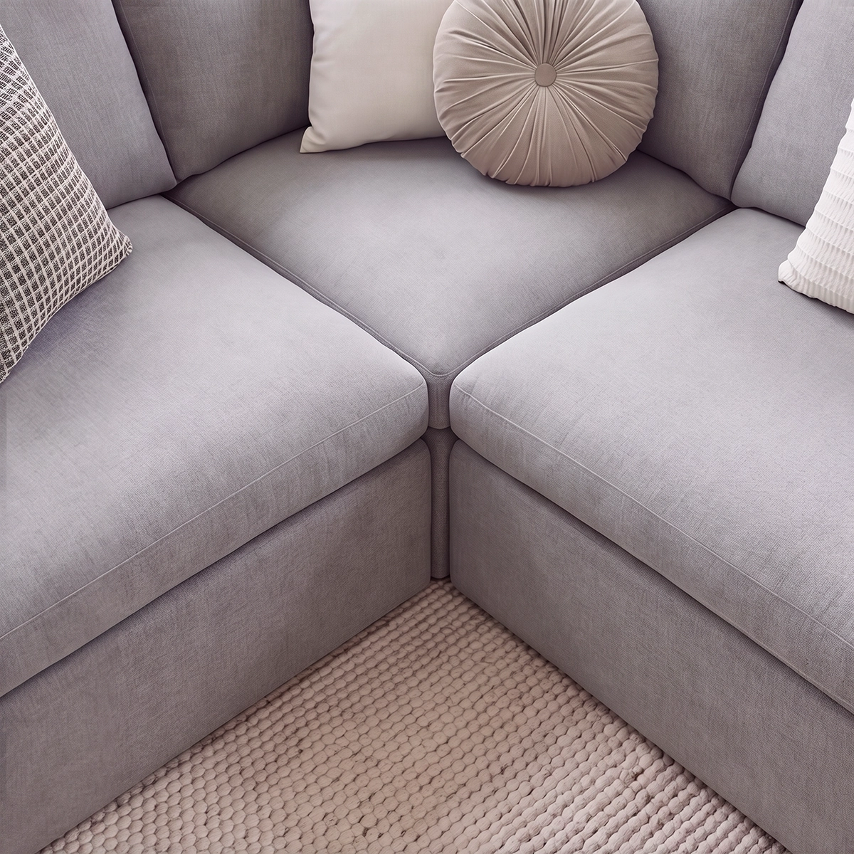 Close-up of Nuvola Corner Sofa modular seat cushions and textured fabric – Asbar Furniture