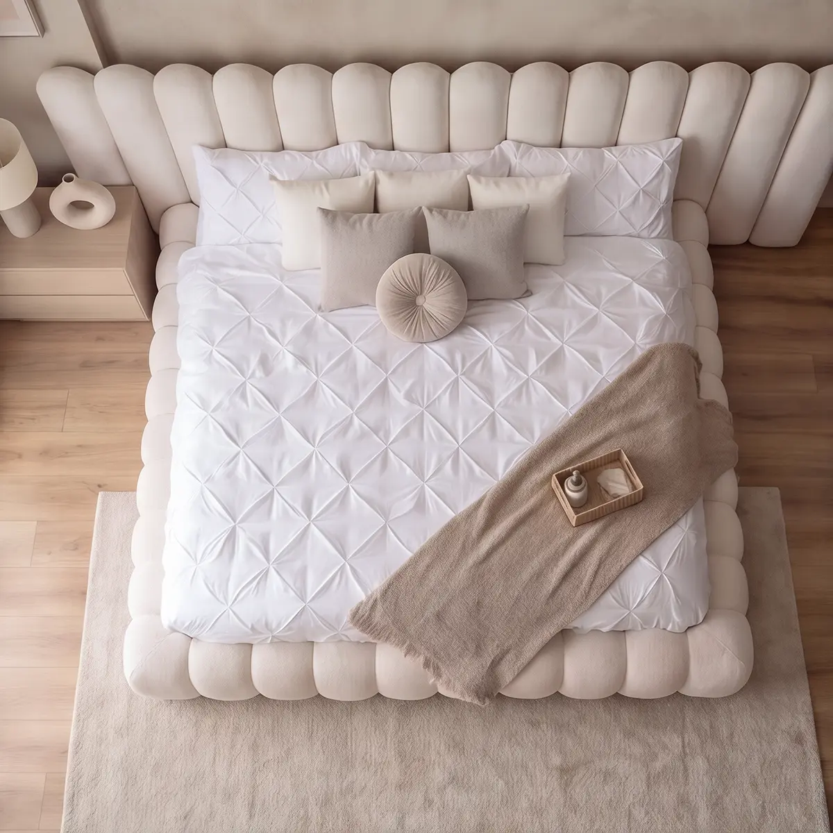 Overhead shot of Recamara cream upholstered king bed with plush tufted frame